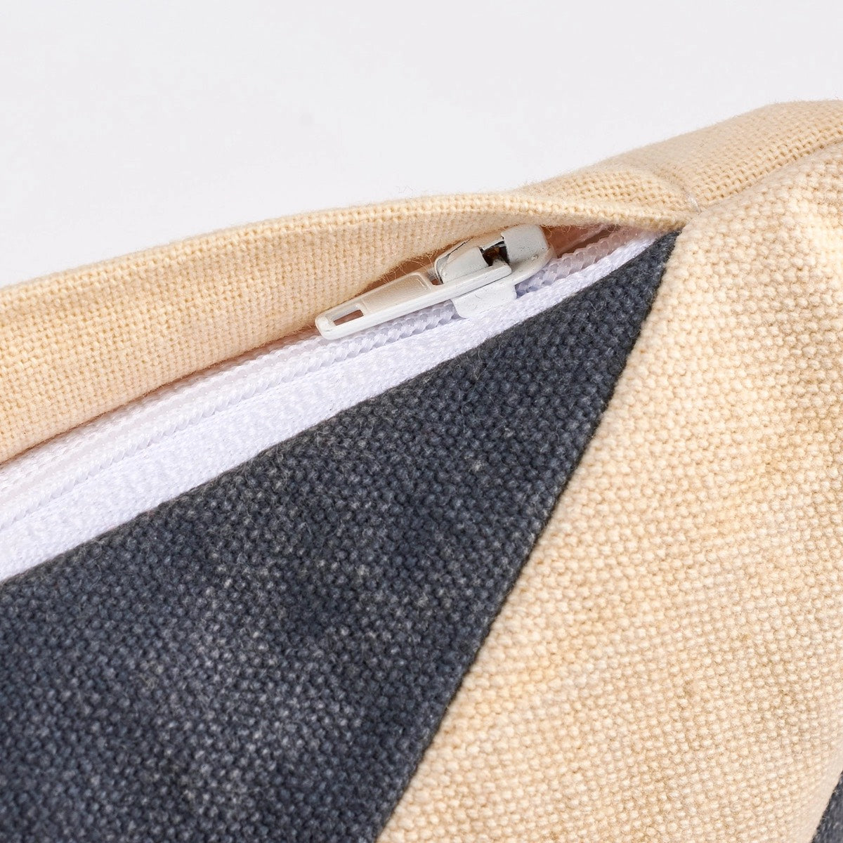 Close-up of a zipper on the At Rest Pillow