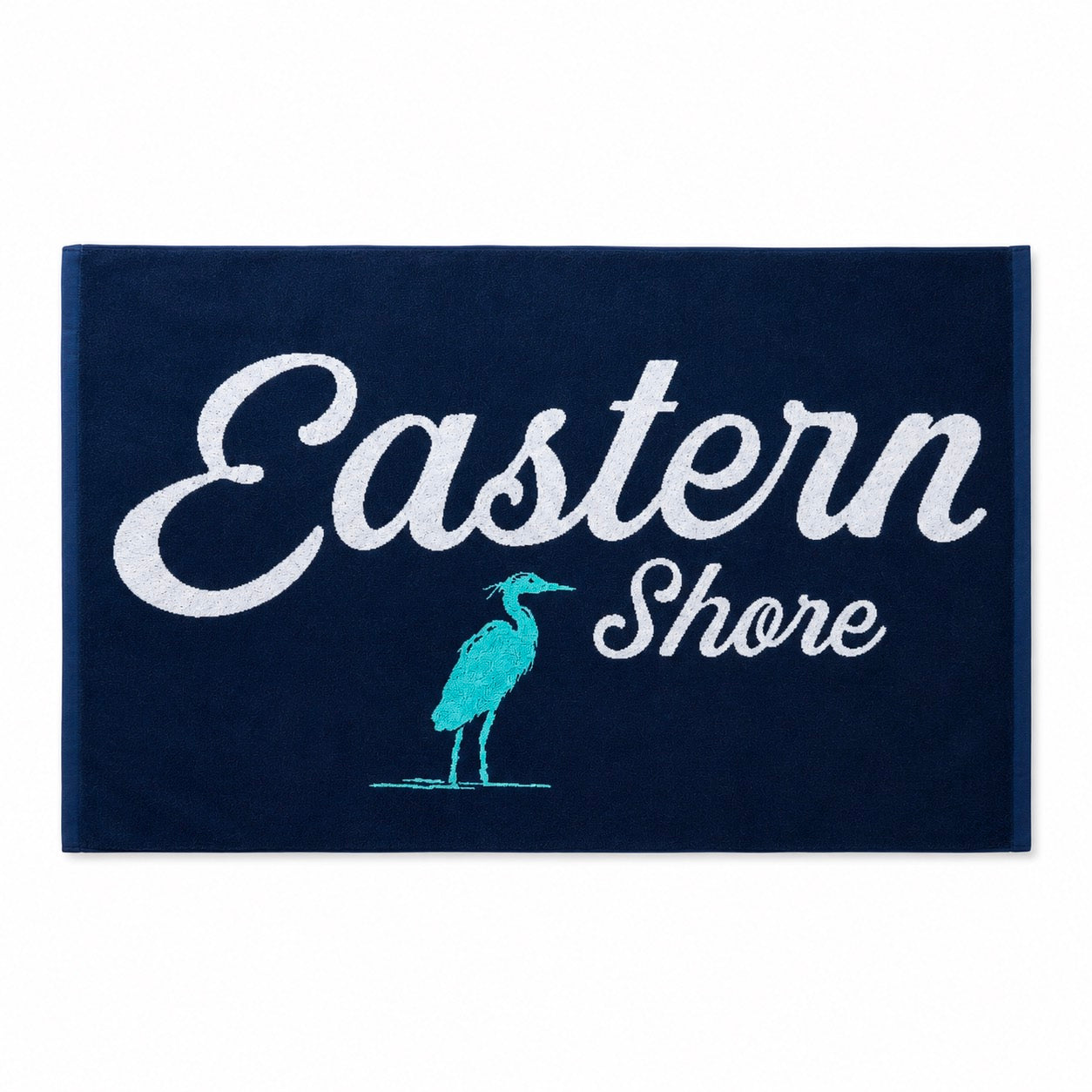 A rectangular navy blue mat or rug with the words &