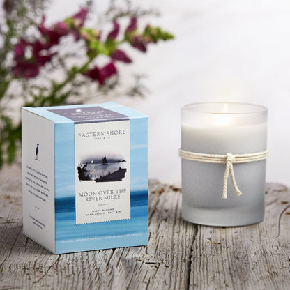 Moon over the River Miles scented 10oz candle, Eastern Shore Co. Candle box with candle on wooden board. Hand poured in very small batches on the eastern shore. saint michaels, st. michaels, moon, moonlight, moonlit, amber scent, jasmine scent, night blooms scent, summer candle, sultry candle, Scented candle, coconut soy wax, coastal candle, eastern shore, Chesapeake Bay, luxury candle, hand-poured, Maryland, Virginia, 