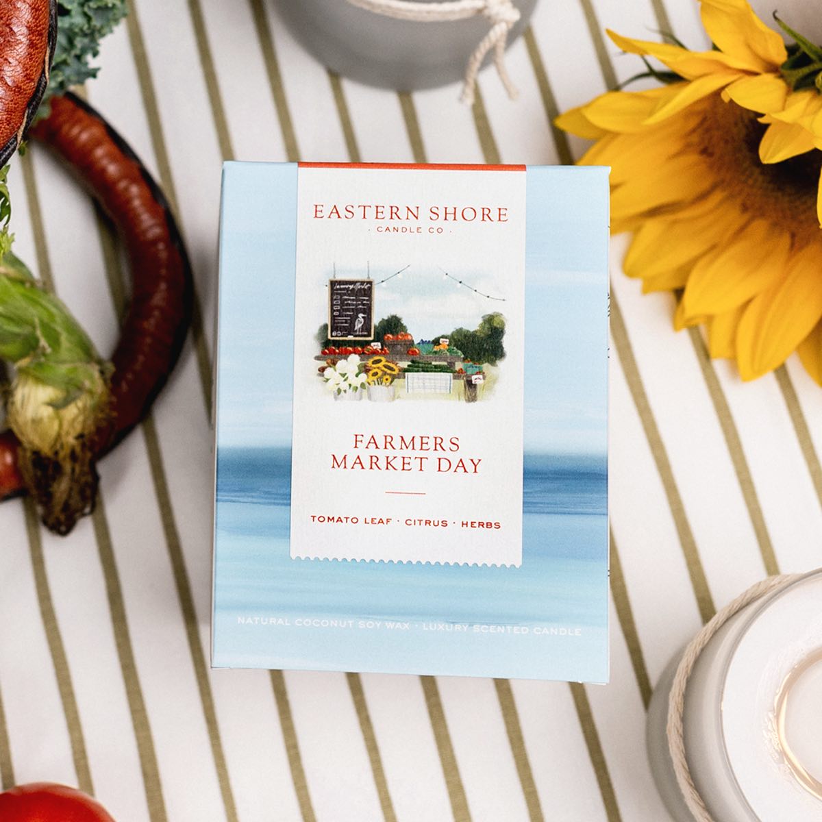 Farmers Market Day Candle Box showing illustration.  Eastern Shore Co. Scented candle, coconut soy wax, coastal candle, eastern shore, Chesapeake Bay, luxury candle, hand-poured, Maryland, Virginia, candle gift, coastal gift, Farmers Market Day, Farmer’s Market, Farmers Market, Farm, Tomato scent, Tomato leaf, tomato leaf scent, herbal candle, eastern shore farm, fresh herbs, hand-poured in very small batches, Cambridge MD