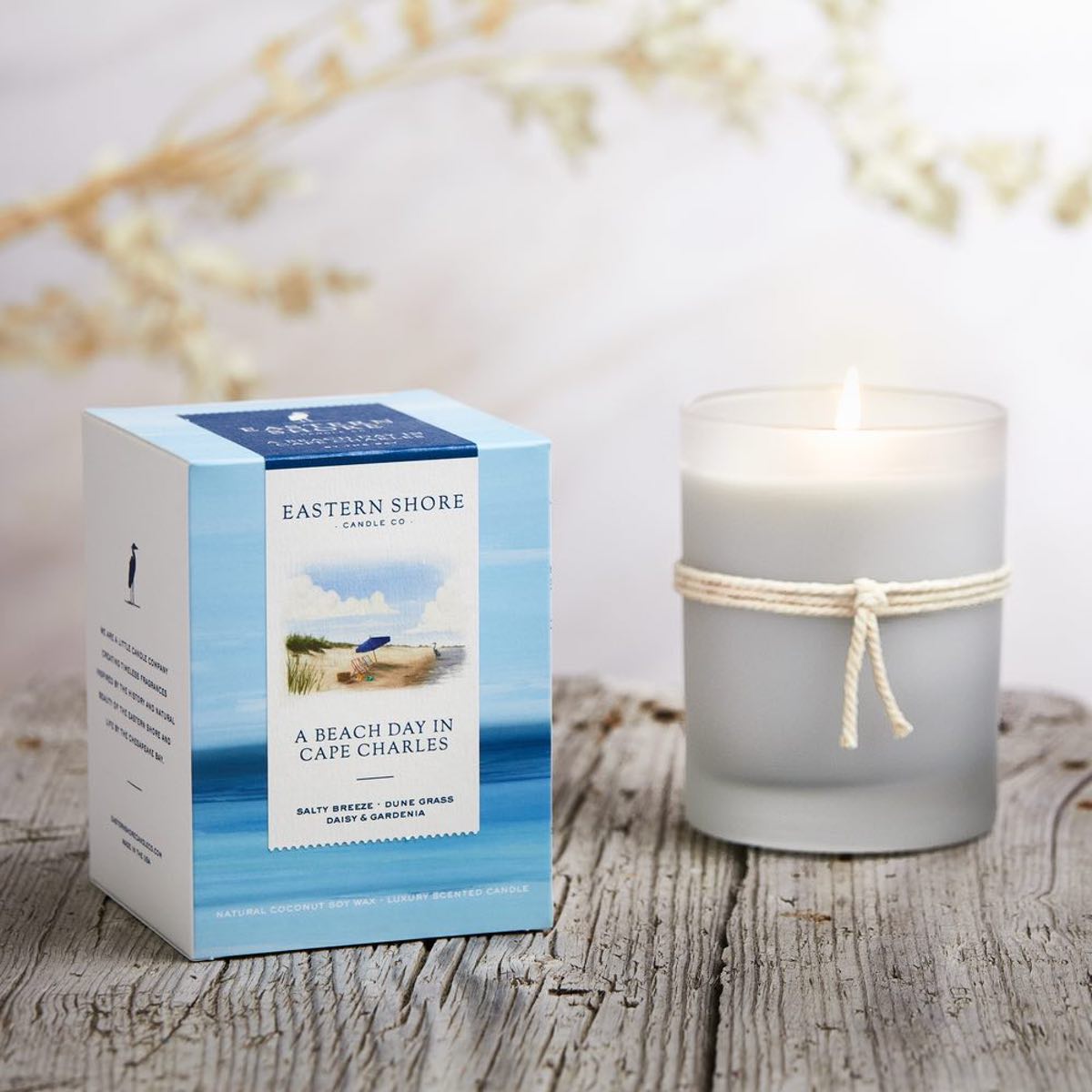 Beach Day in Cape Charles 10oz candle with box on wood table, Eastern Shore Co., gardenia, dune grass, sea breeze, Scented candle, coconut soy wax, coastal candle, candle gift, coastal gift, eastern shore, Chesapeake Bay, luxury candle, hand-poured in very small batches, Maryland, Virginia, Cape Charles Virginia, Beach day, beach candle, coastal candle, scented candle, eastern shore, Chesapeake Bay