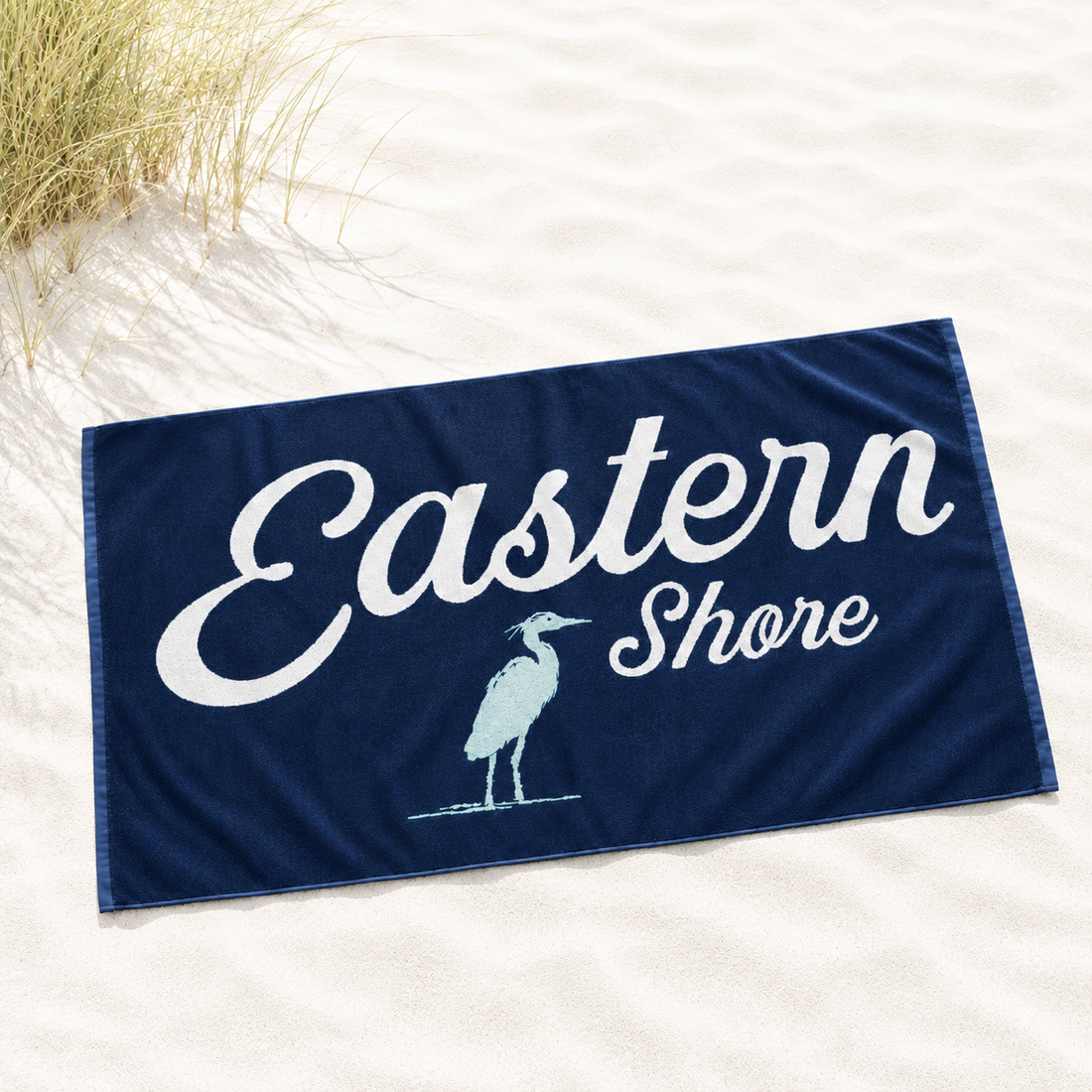 A navy blue beach towel with &